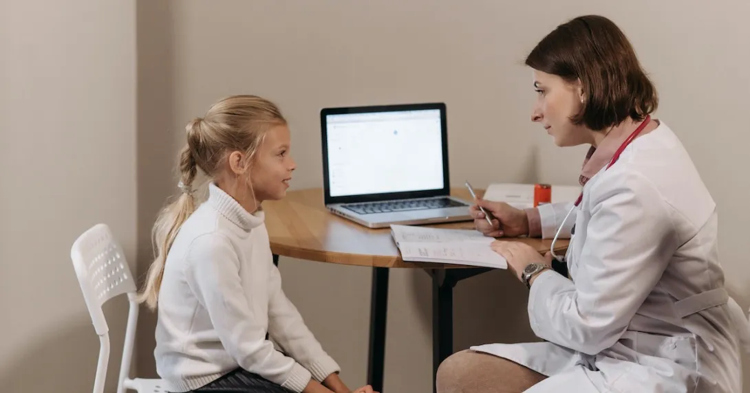 A young patient in consultation with a doctor