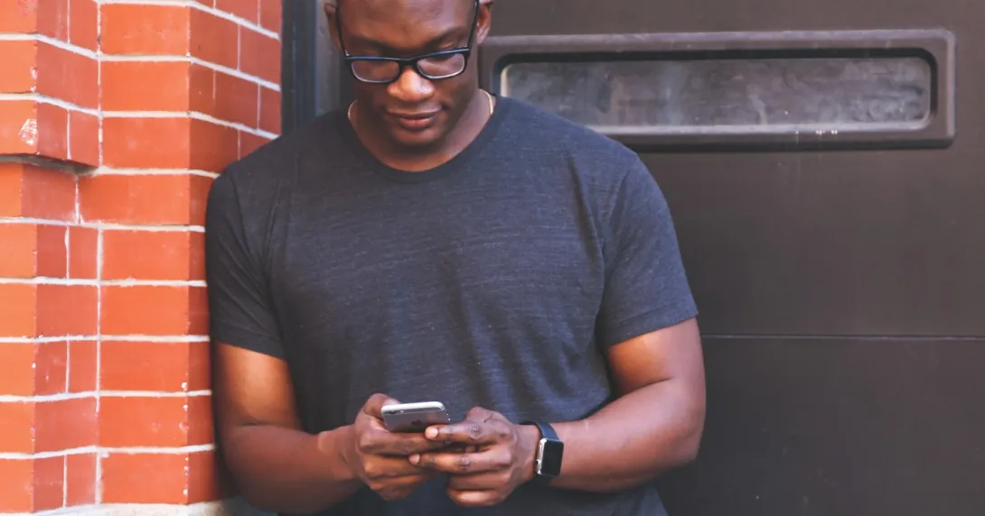 Man reading smartphone