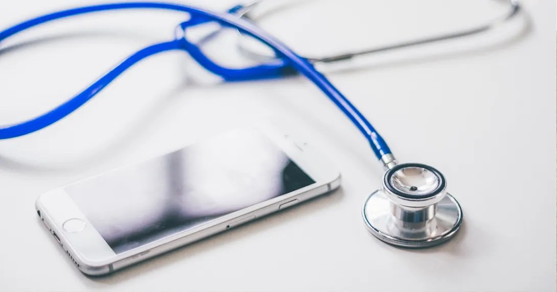 Stethescope and mobile phone on a table