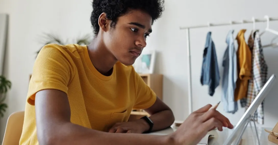 A teen using a computer