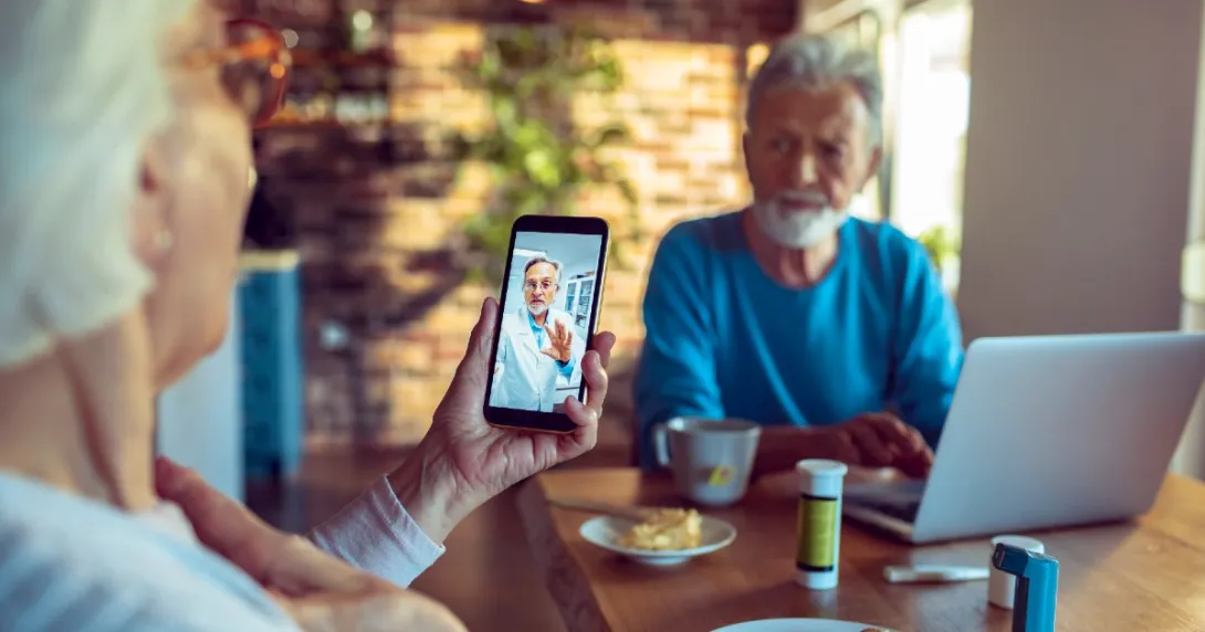 A couple consulting with a doctor via telemedicine