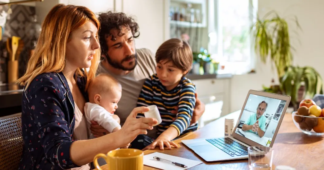 A family speaking to their doctor via videochat