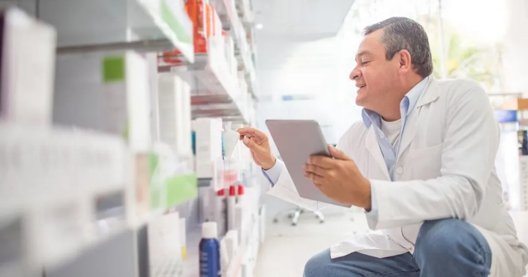 A pharmacist doing inventory at a drug store