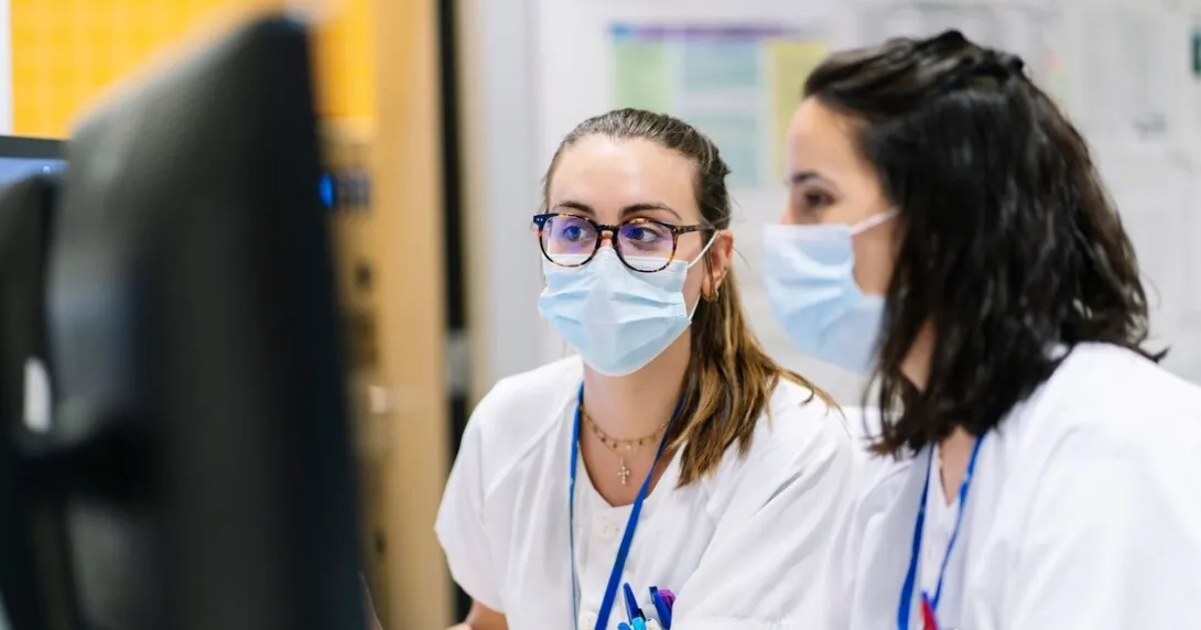 Clinicians examine imaging for oncology treatment