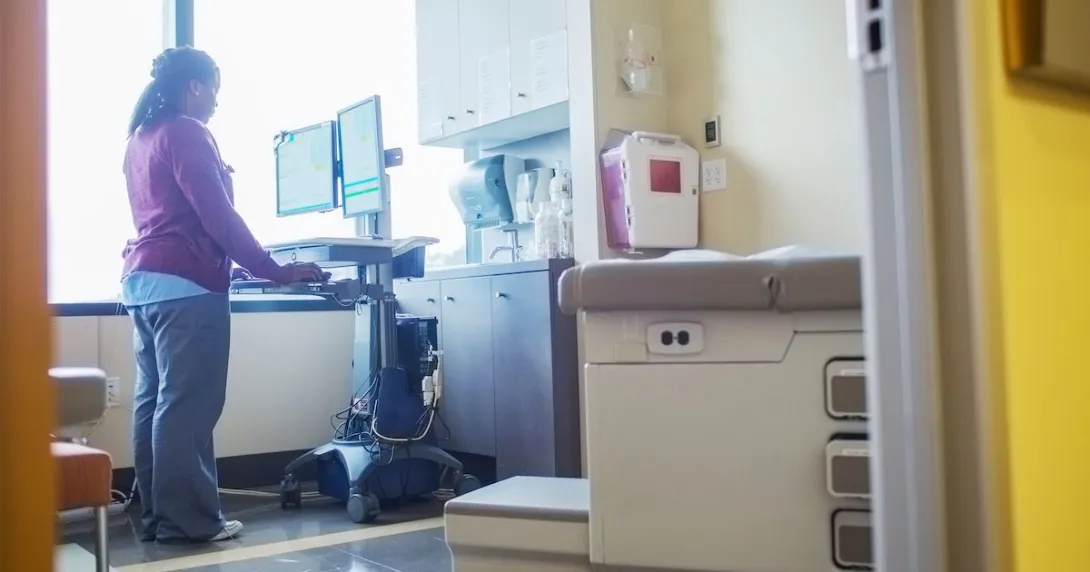 A nurse looking up a patient's record