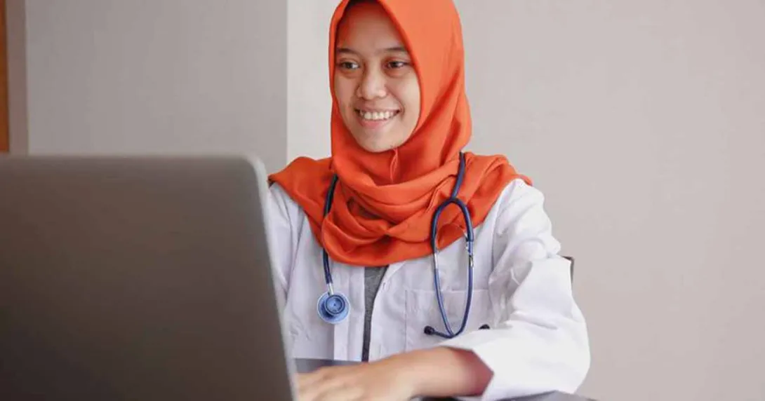 Doctor using laptop