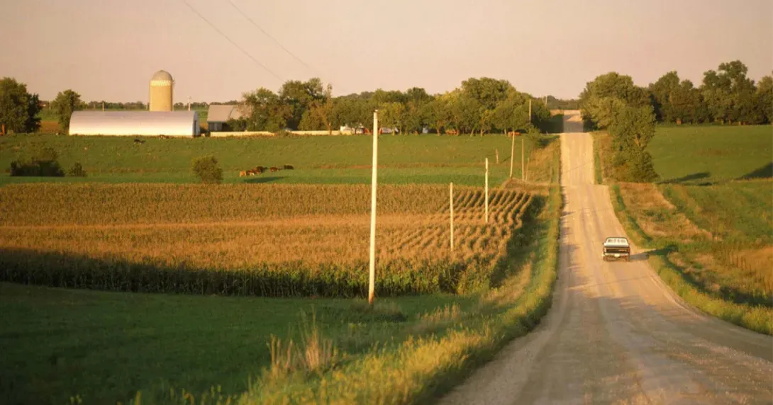 Rural road goes by farm