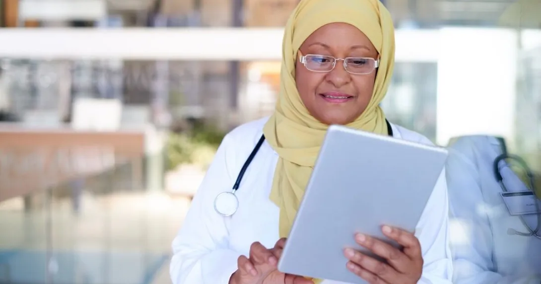 A doctor using a digital tablet