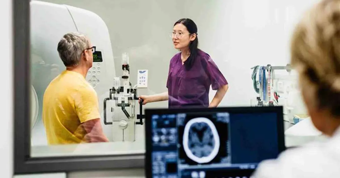 Healthcare workers conducting medical scan on patient