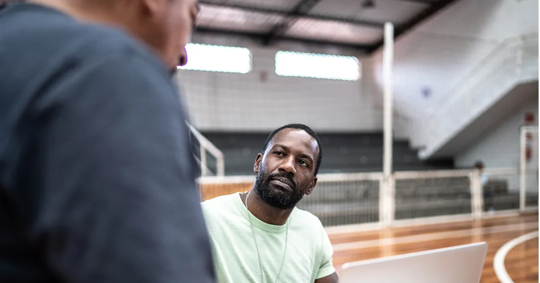 Community worker talks with patient
