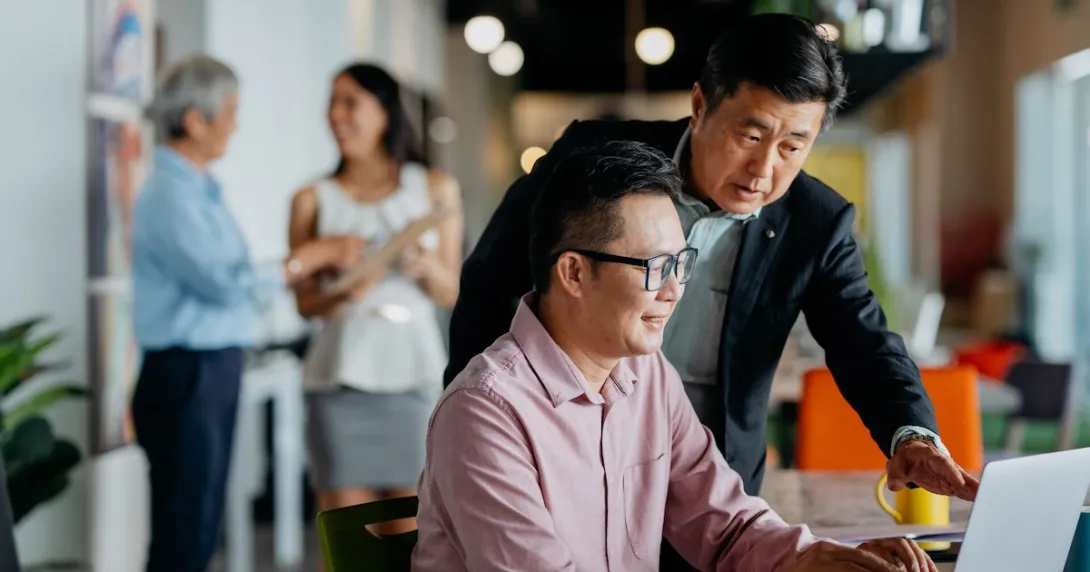 A mentor and mentee session using a laptop computer