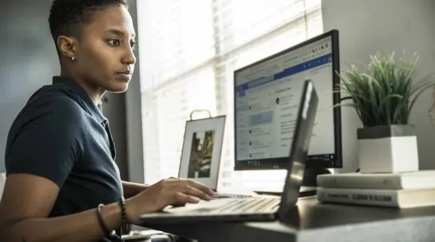 Healthcare billing specialist at her desk