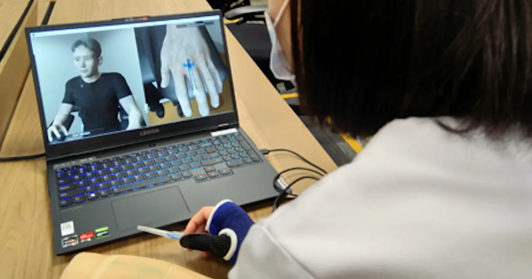 A nurse demonstrating IV cannulation using the IV NIMBLE VR training programme