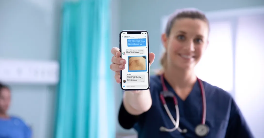 A nurse showing the Celo Health mobile app