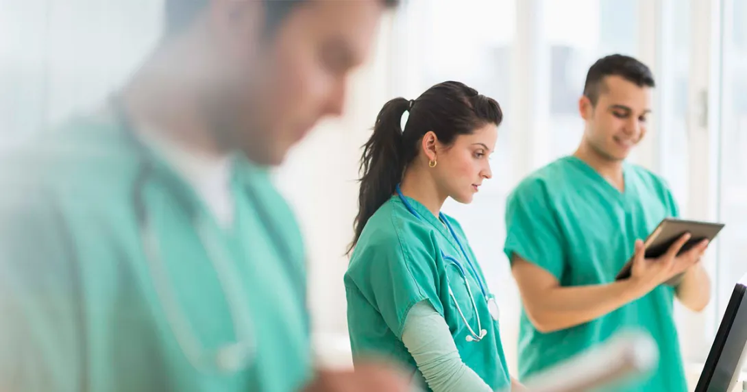 Nurses working with tablets and laptops