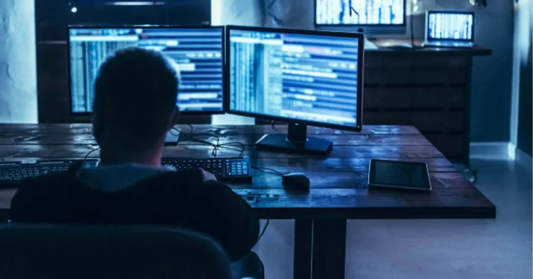 Dark monitors on a desk and more on a dresser