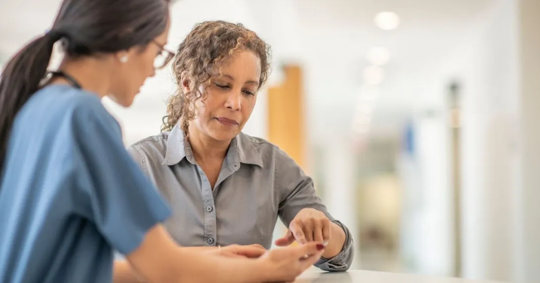 Doctor and patient work with smartphone