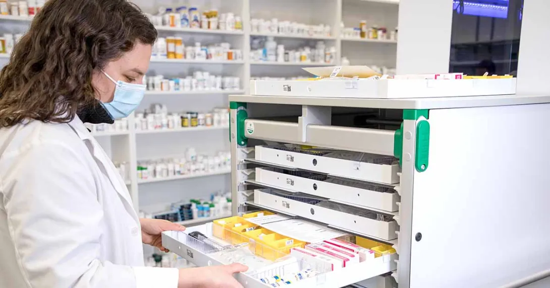 Pharmacist sorting pills