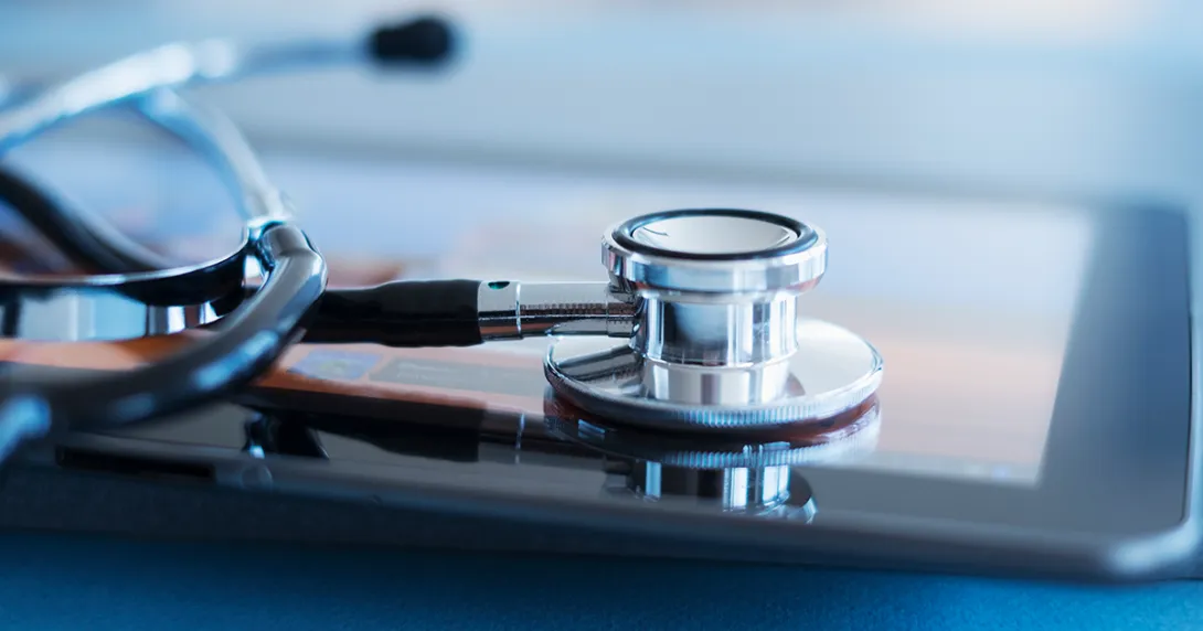 Stethoscope resting on tablet
