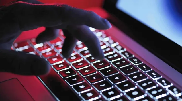 hand on backlit laptop keyboard