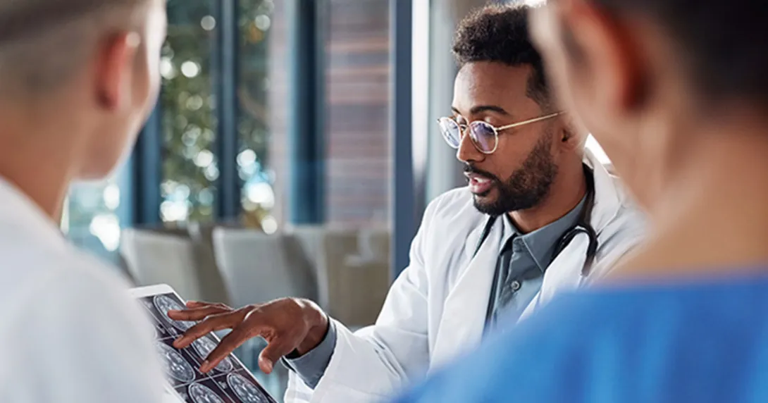 Three clinicians review radiology images