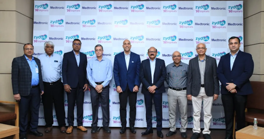 Zydus Hospitals and Medtronic officials pose for a photo during the signing of their stroke partnership