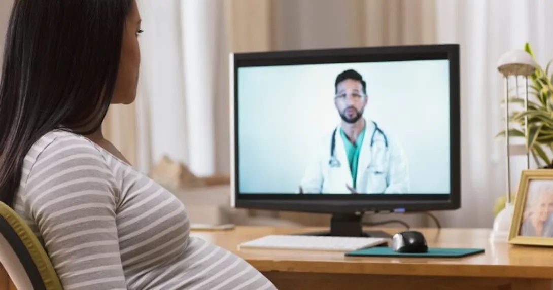 Pregnant person talking to doctor on screen