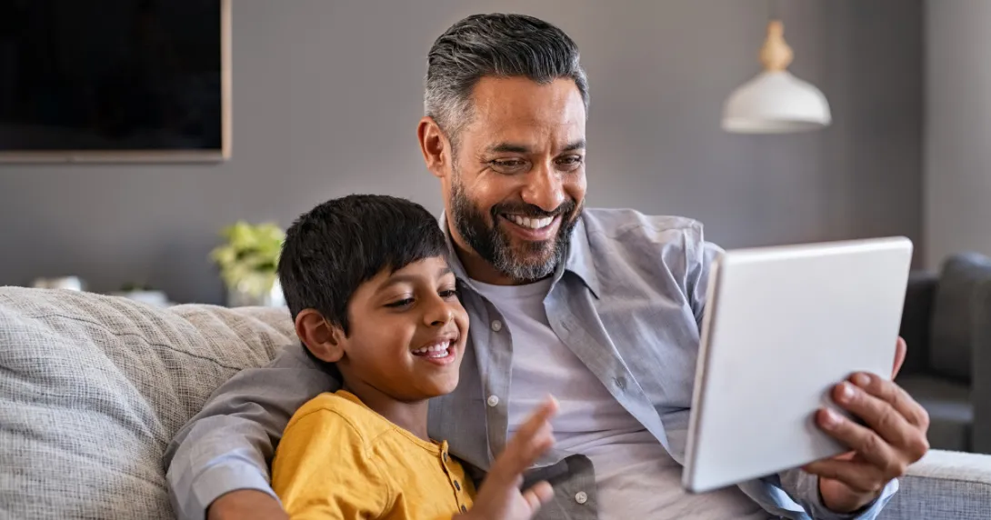 Parent and child looking at tablet