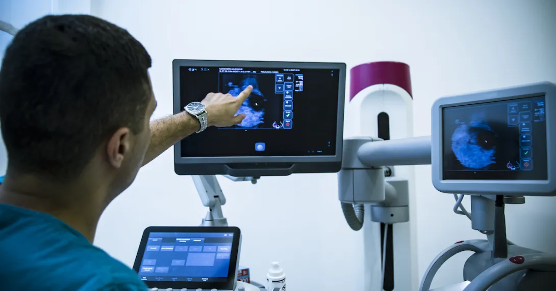 Radiologist examines imaging scan
