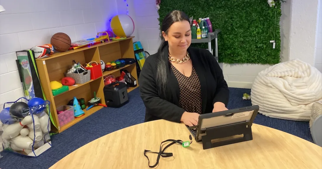 A carer support staff accessing a digital tablet using a passwordless security key