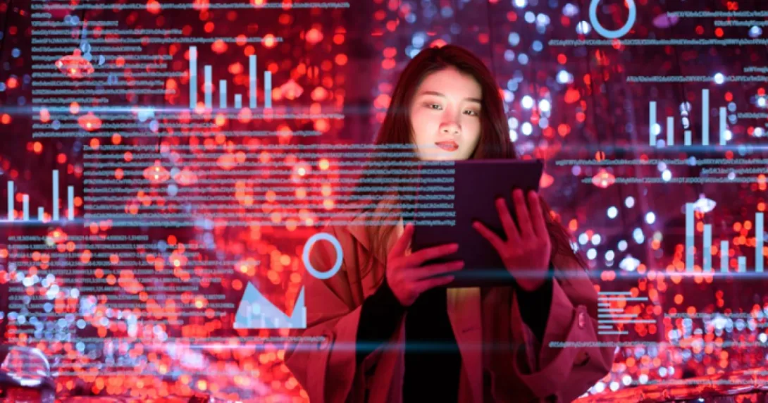 A woman holds up a tablet and data overlays appear all around her.