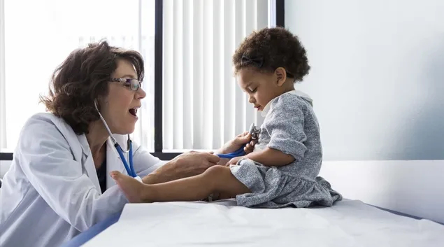 Doctor treating child