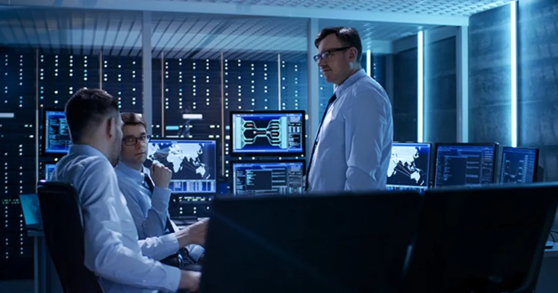 IT professionals meet in a server room