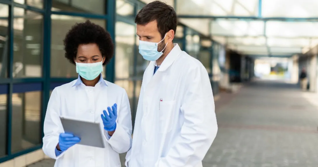 doctors looking at a tablet