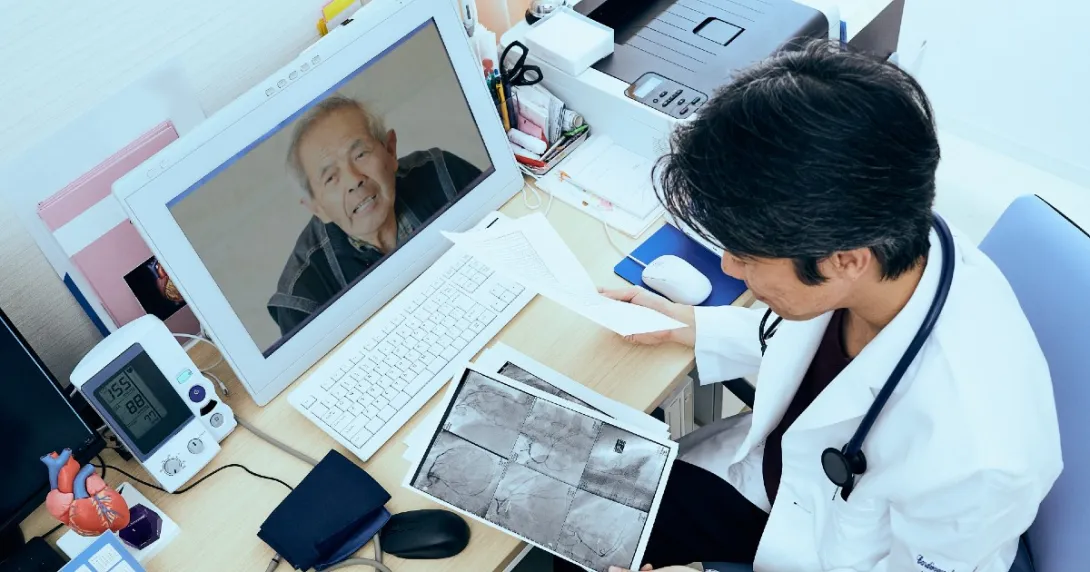 Doctor looks at imaging in a telehealth session with a patient