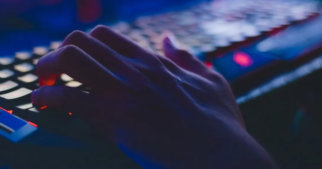 Hacker hand on keyboard