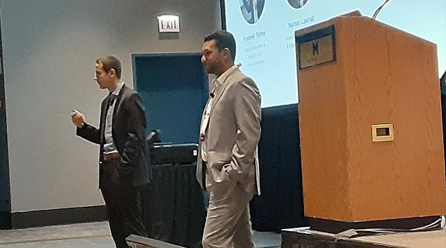 Dr. Frederik Floether, left and Dr. Numan Laanait discuss quantum computing at the HIMSS23 Global Conference in Chicago on Wednesday.