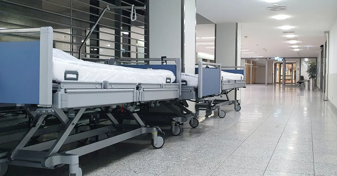 Hospital beds parked in a corridor