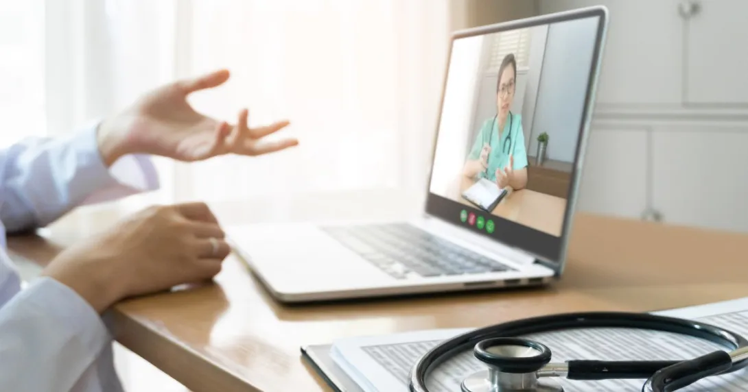 A female surgeon appears on a laptop with a stethoscope in foreground.