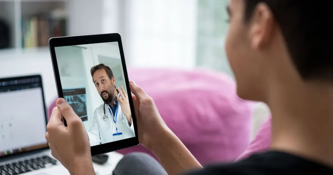 Person talking to doctor on tablet