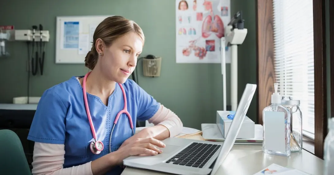 healthcare worker using laptop