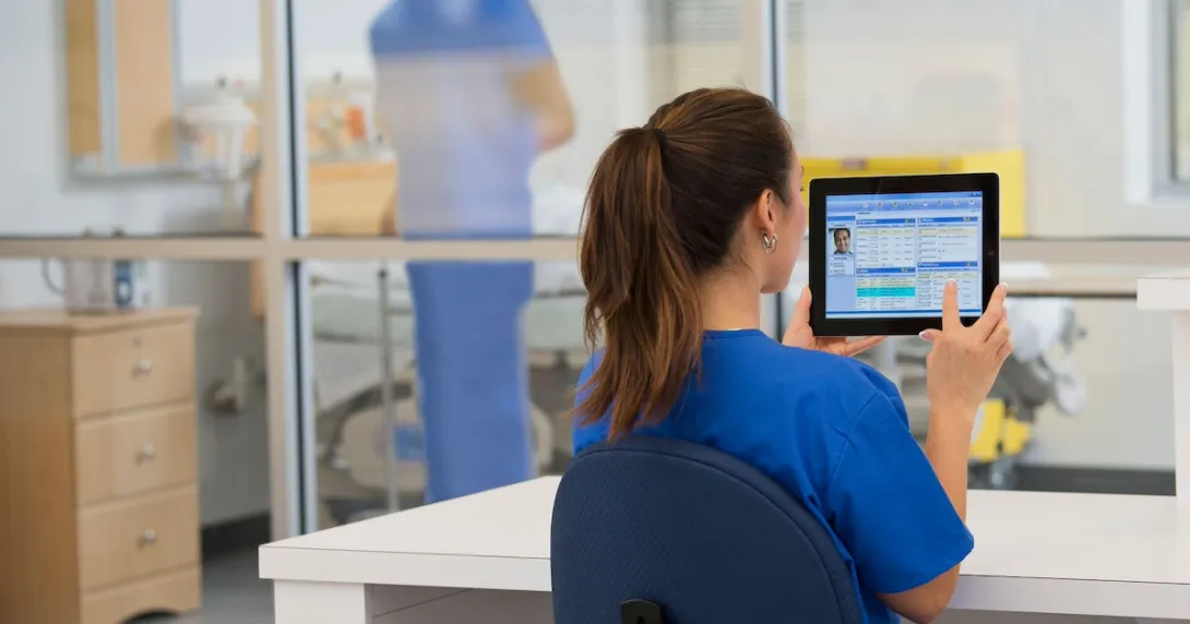 Clinician works with tablet computer